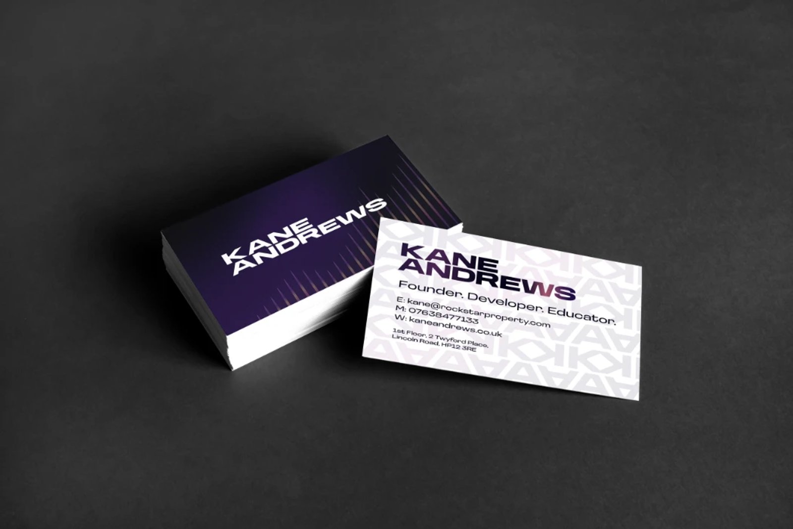 A stack of Kane Andrews business cards