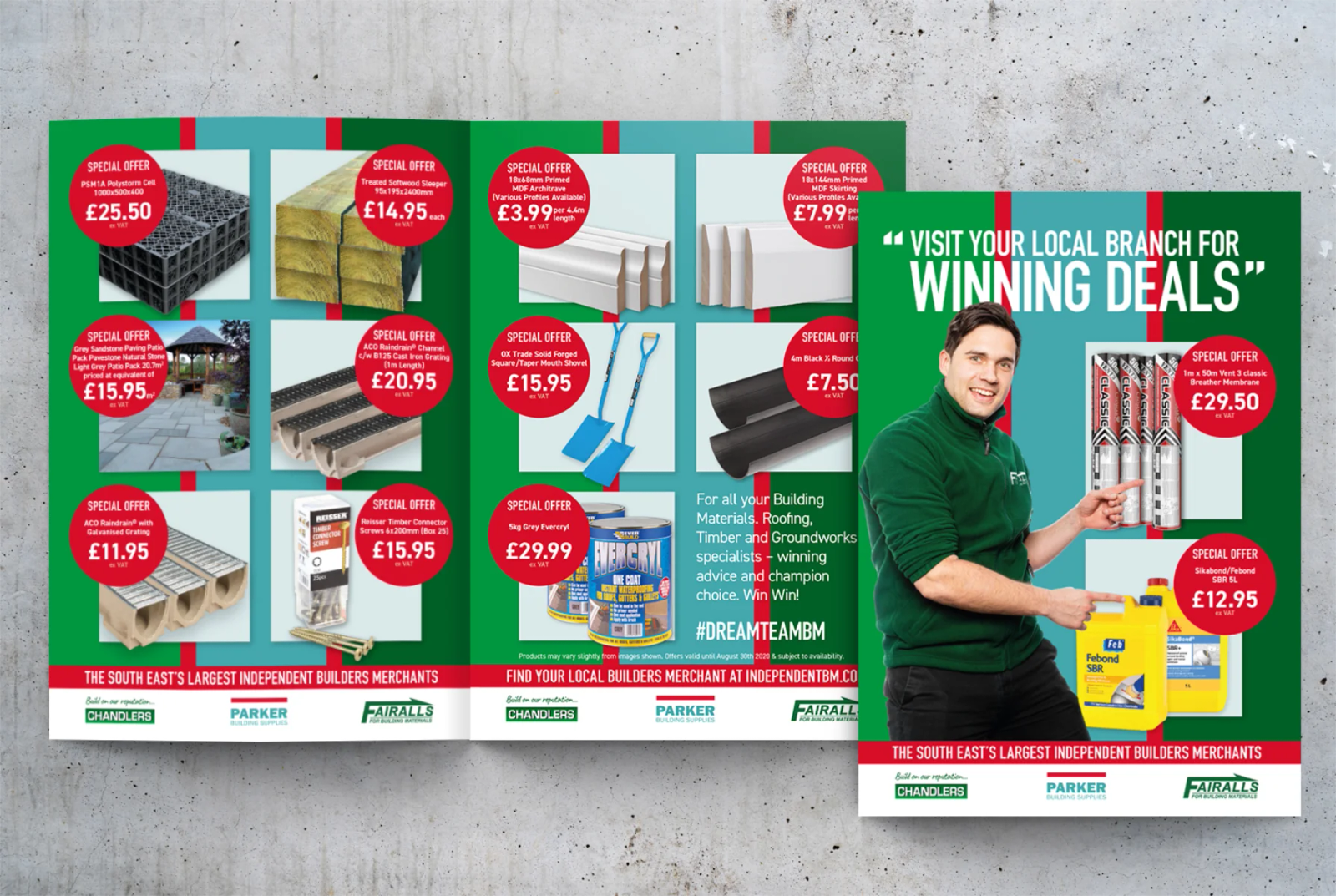 A billboard reading 'We're now in a different league' showing a Chandlers and a Parker Building Supplies staff member wearing matching scarves