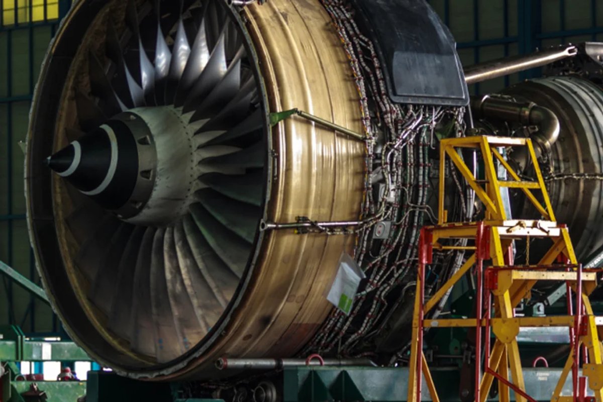 An aircraft engine without fairings, undergoing maintenance