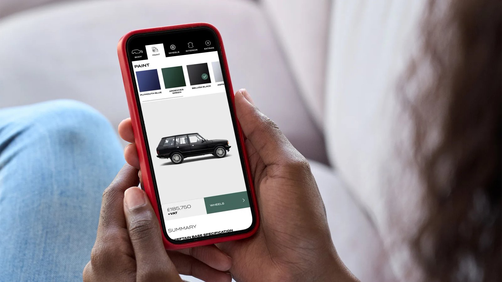 A phone showing the Chieftain configurator paint page, with a black Range Rover and a price of £185,750