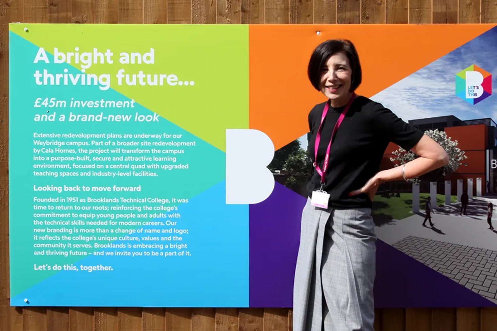 A woman stood in front of a Brooklands sign
