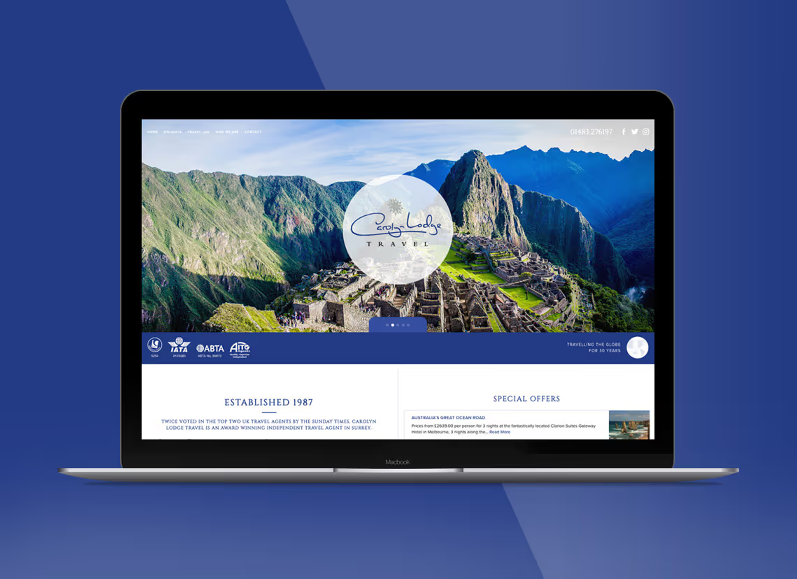 A mockup of the Carolyn Lodge homepage on a laptop