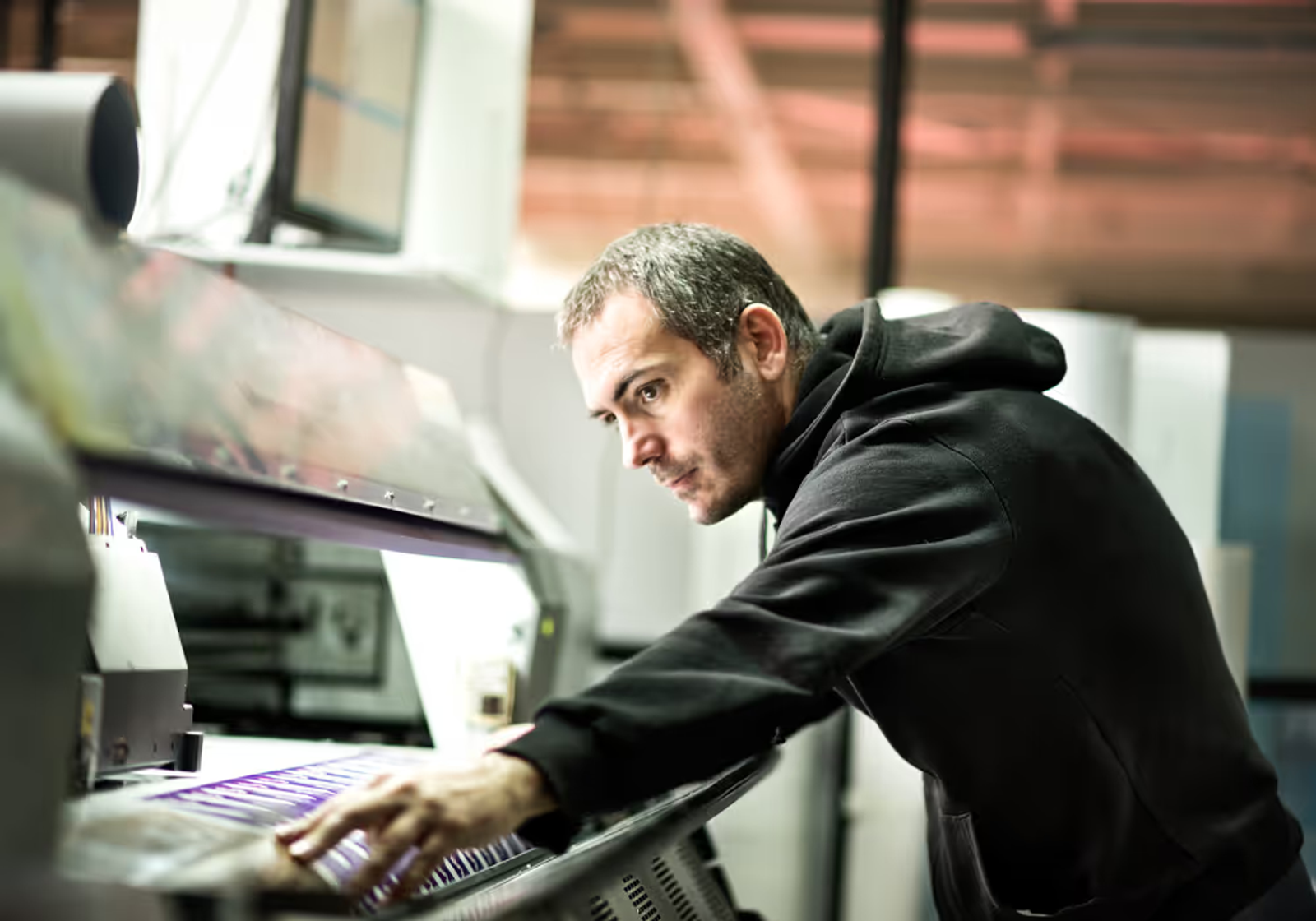 A man using a printer