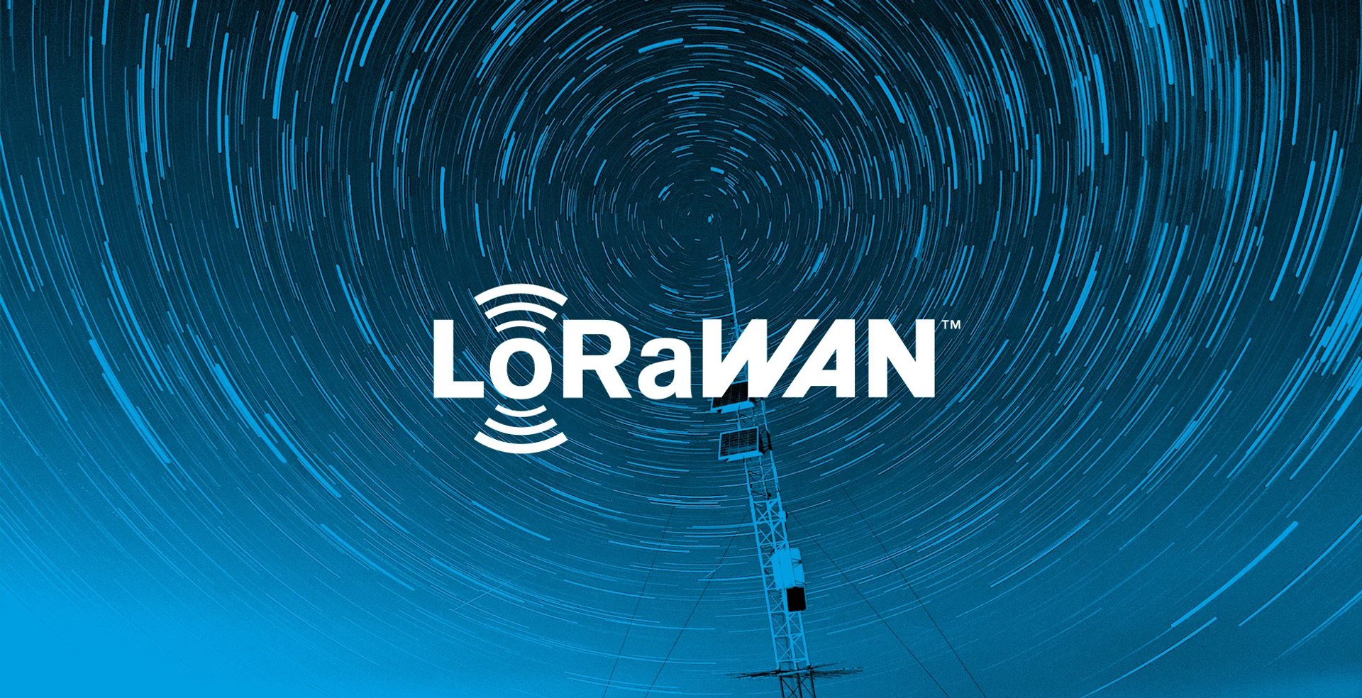 LoRaWAN logo over a long-exposure night sky with circular star trails behind a radio mast