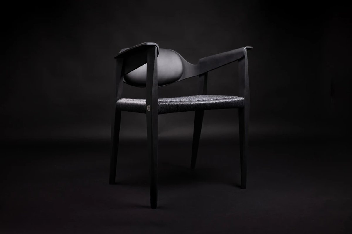 A black chair on a black background
