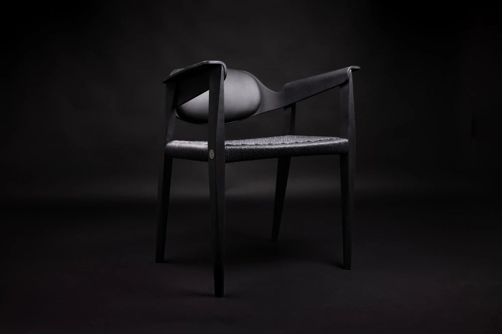 A black chair on a black background