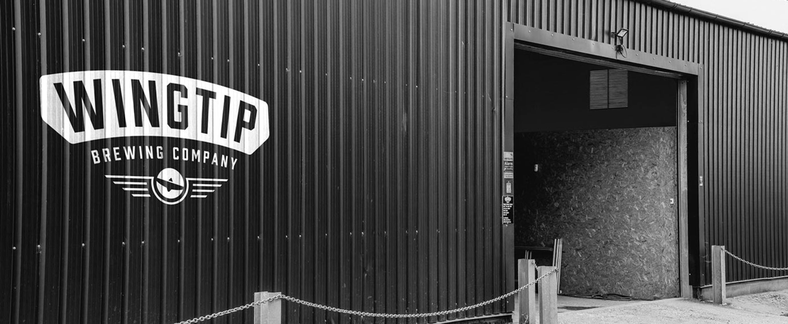 Wingtip Brewery warehouse in black and white
