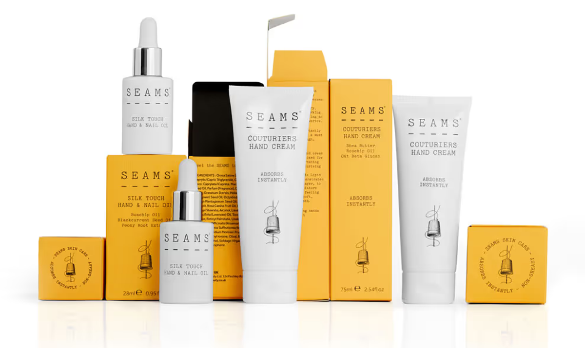 Seam beauty products arranged on a white background