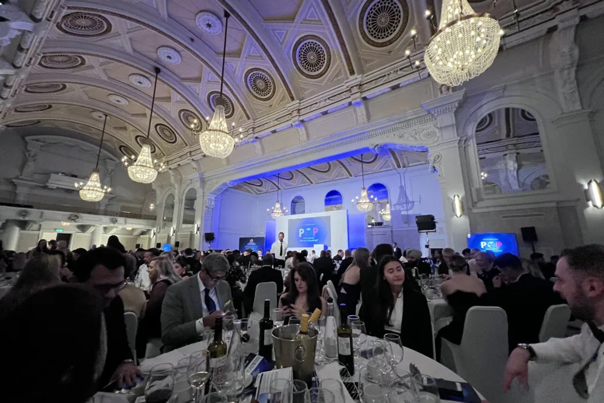 An event in a banquet hall with many guests and round tables