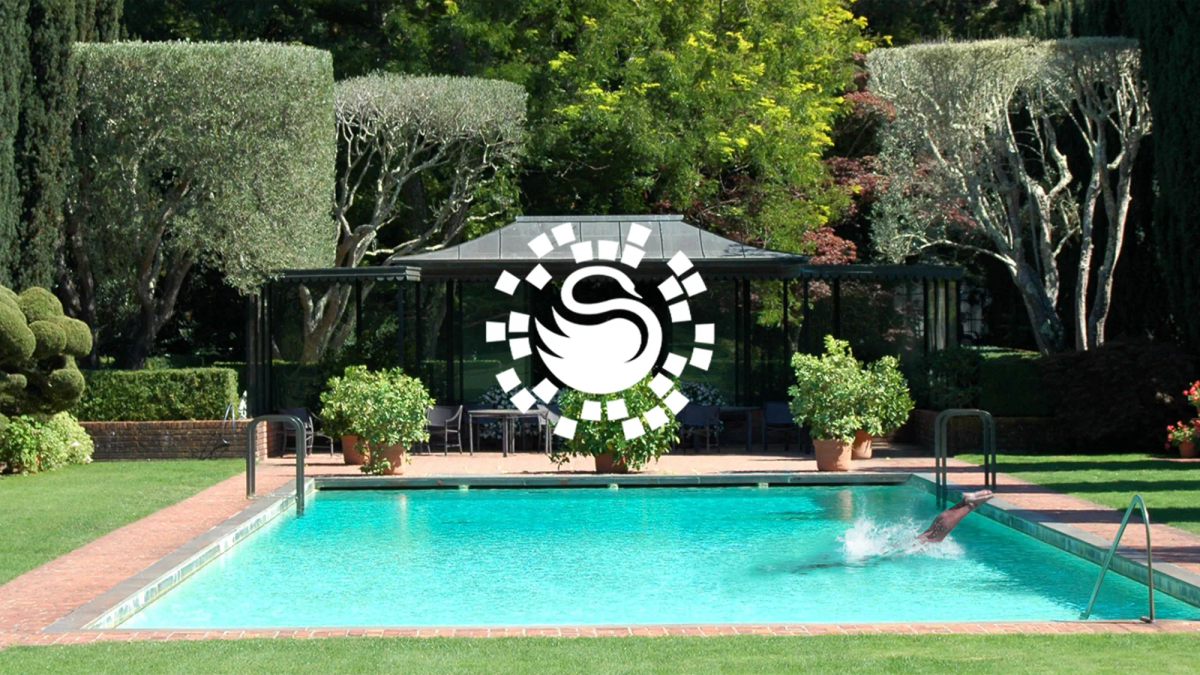 Surrey Swimming Pools logo overlaid on a garden swimming pool with a person diving in
