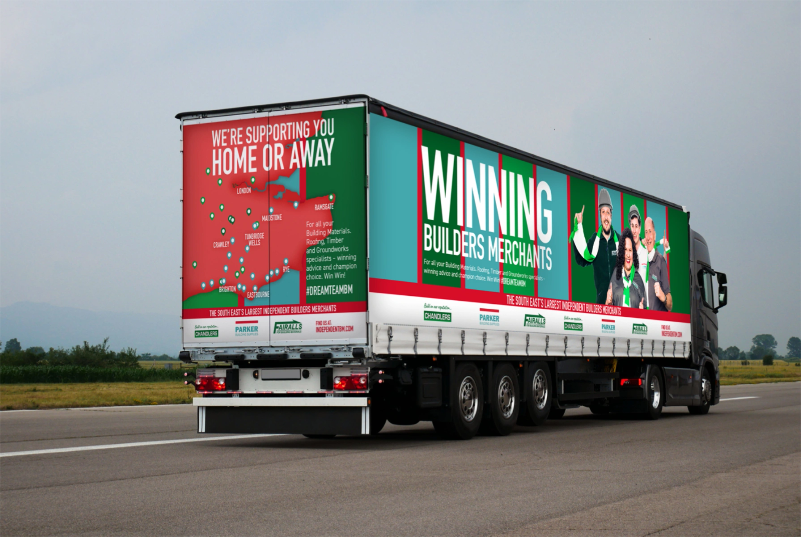 An articulated lorry on a road, branded with the 'Winning Builders Merchants' campaign and a map of South East branch locations