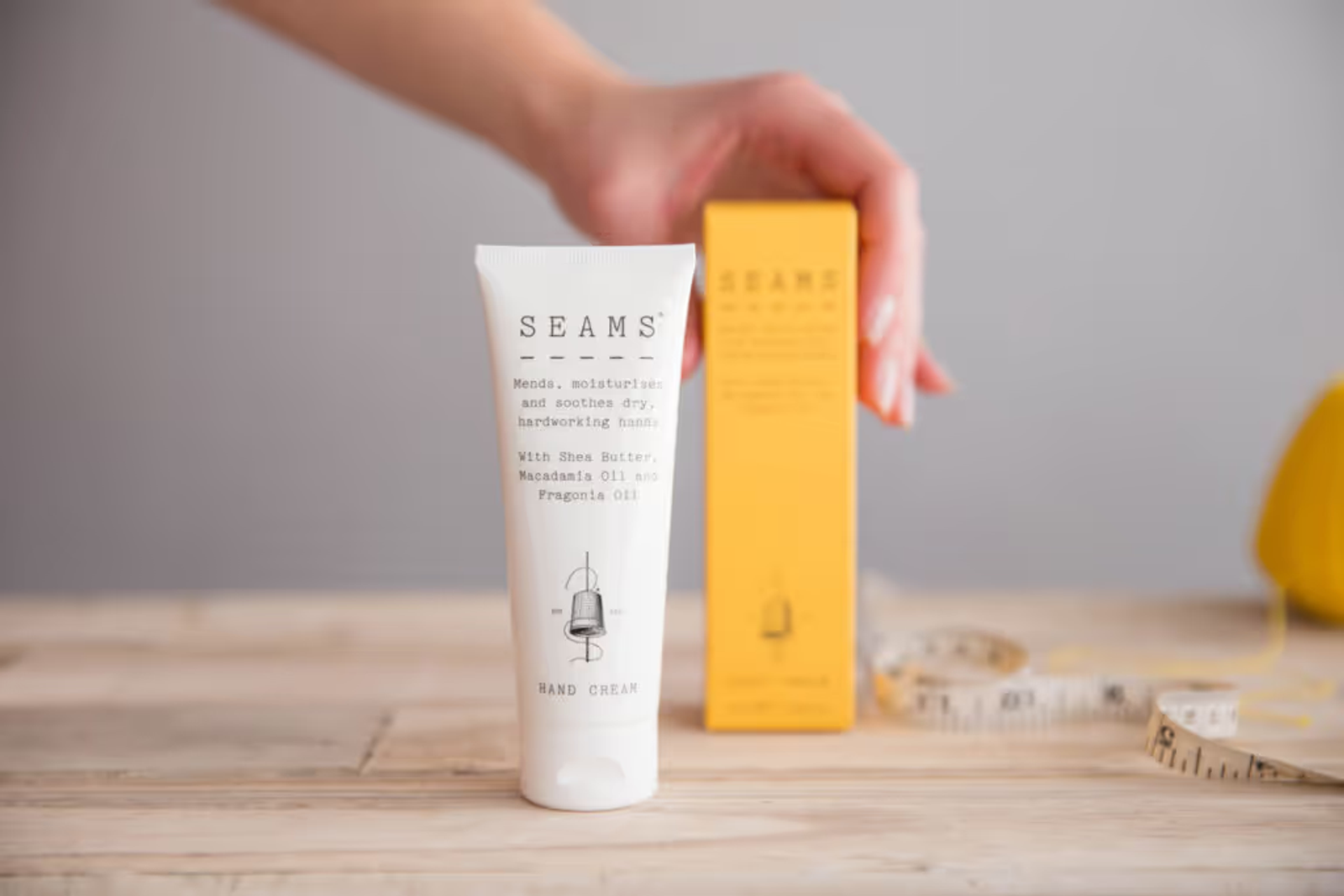 Two Seams beauty products on a wooden table