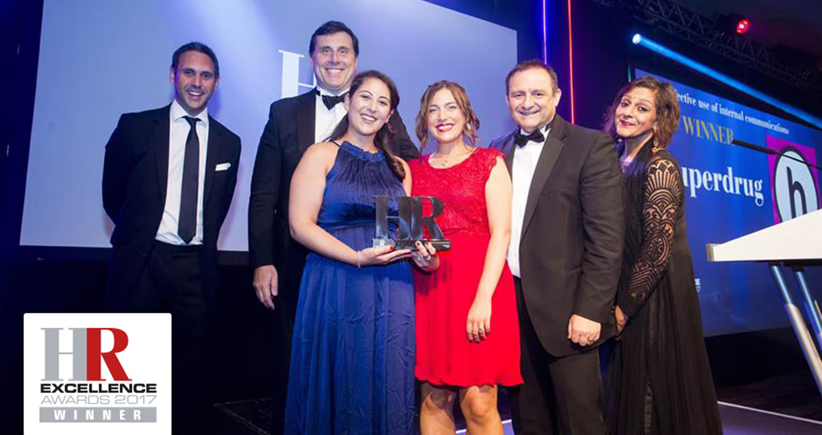 An image of the Superdrug team on stage collecting an award