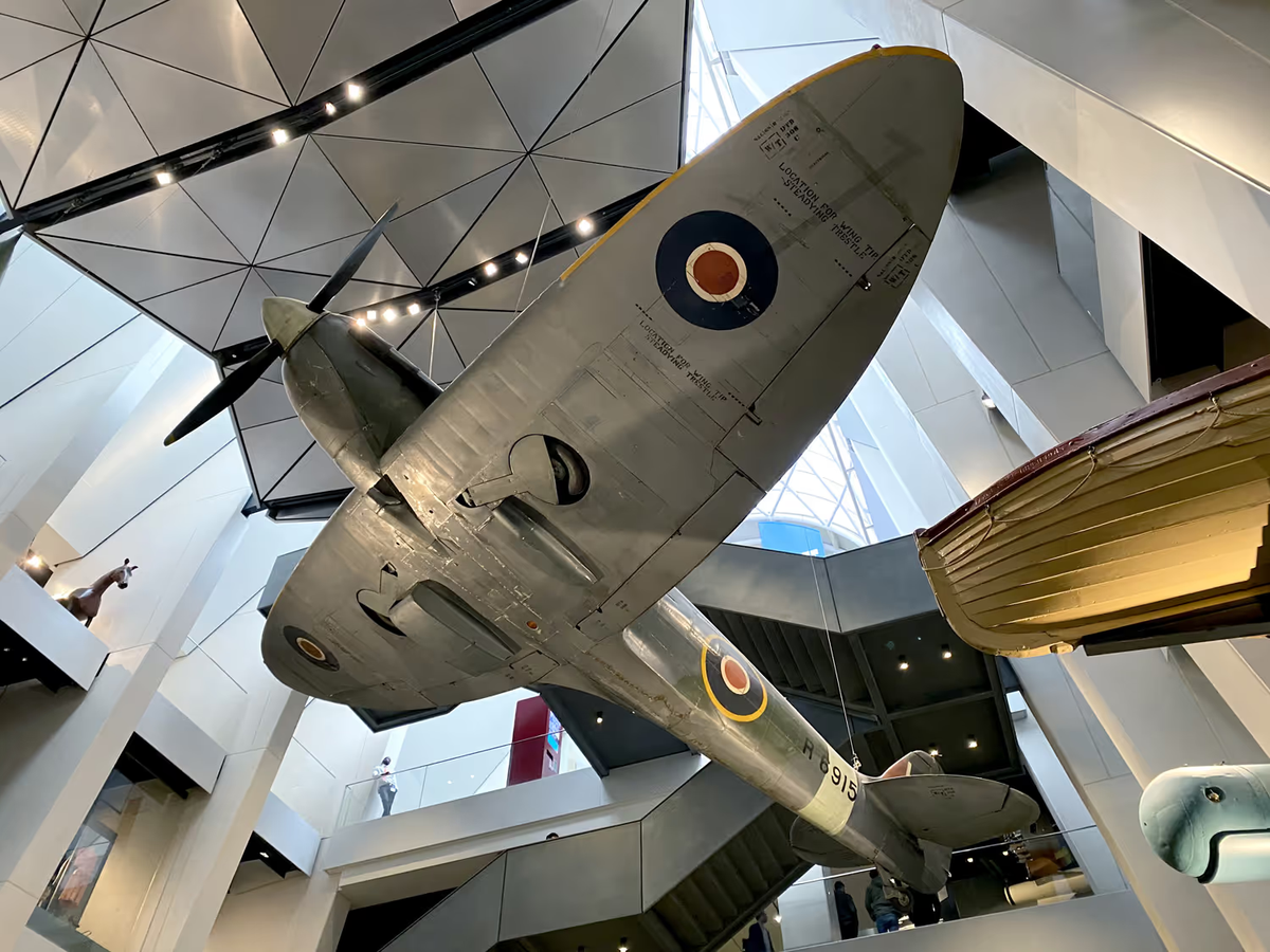 A plane hanging from the ceiling of the imperial war museum