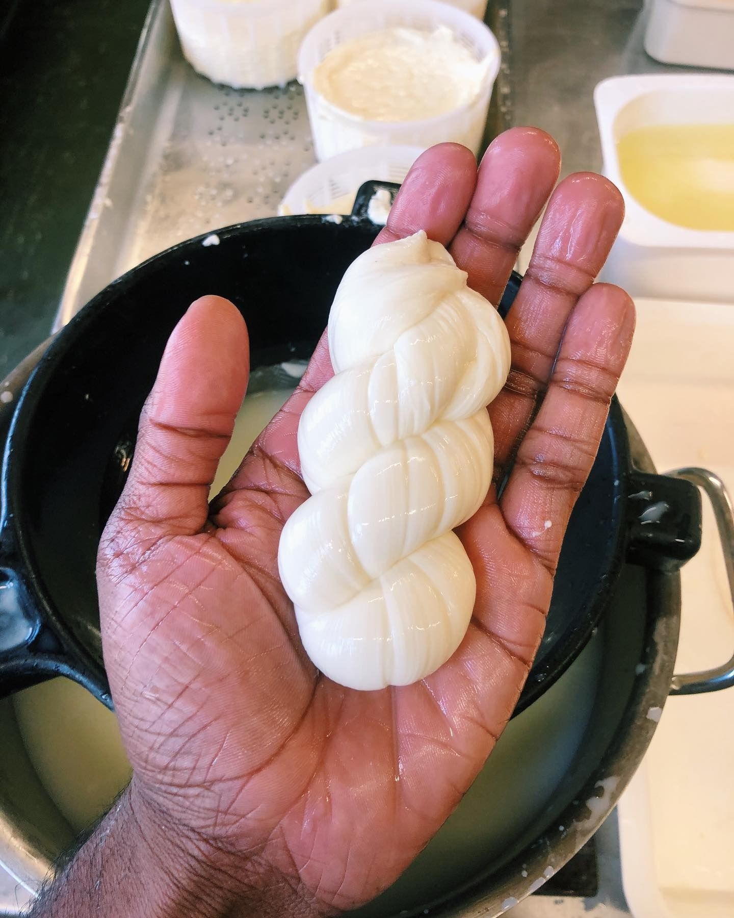 A hand-pulled twist of fresh stretched-curd cheese, still warm