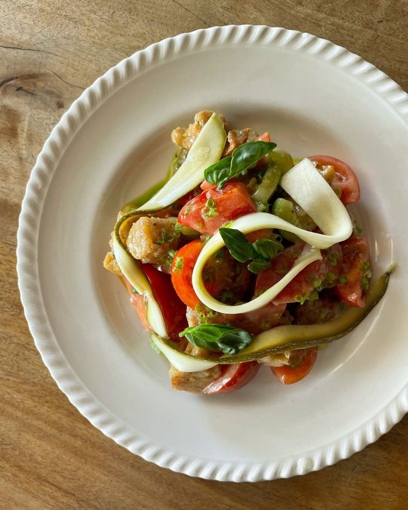 Heirloom tomato panzanella with torn bread and basil