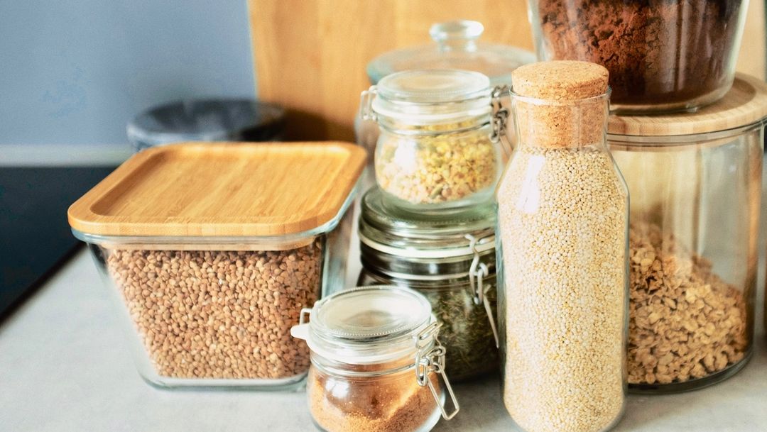 Plastic-Free kitchen options - glass jars and glass containers with wooden tops
