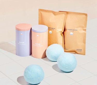 Laundry Essentials Kit: 2 refillable Forever tins, 2 compostable refill pouches, 3 wool dryer balls