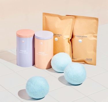 Laundry Essentials Kit: 2 refillable Forever tins, 2 compostable refill pouches, 3 wool dryer balls
