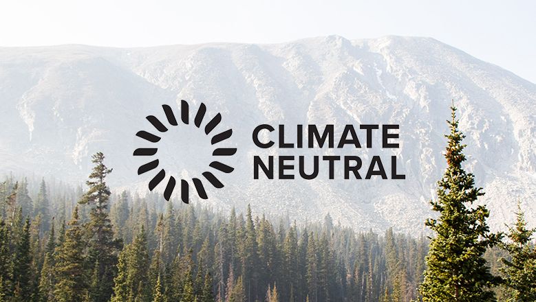 Climate Neutral Logo over Forest Trees
