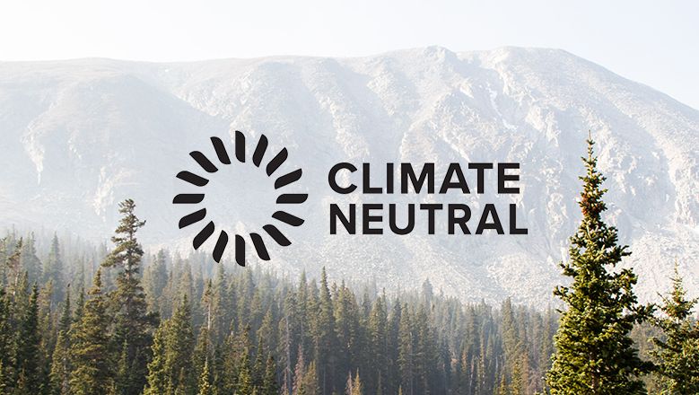 Climate Neutral Logo over Forest Trees