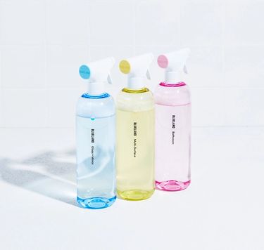 Blueland Clean Up Kit on white tile: 3 refillable cleaning bottles