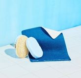 Cleaning Companions Pack: 1 Navy Cloud Cloth, 1 Scrub Sponge, 1 blue Pop-Up Sponge on white tile against blue background