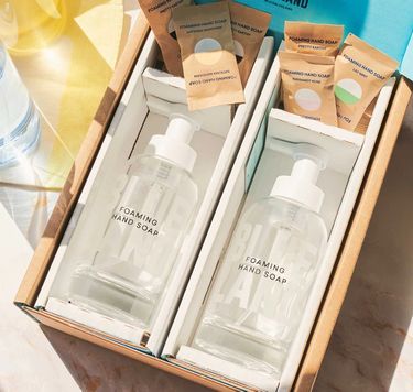 2 glass bottles of foaming hand soap in box with 6 wrapped tablets