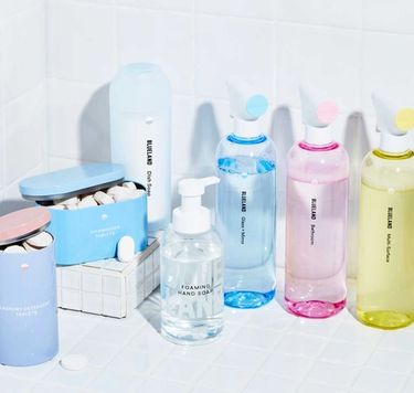 3 refillable cleaning bottles, Foaming Hand Soap, laundry tablets, dishwasher tablets, Powder Dish Soap on white tile