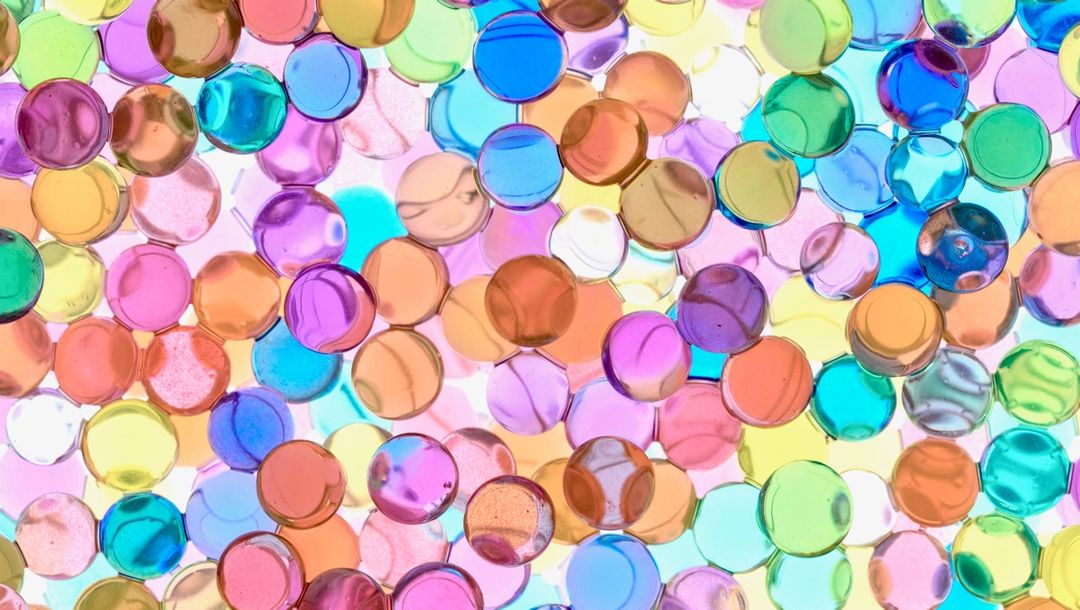 Tiny Plastic circles, multi-colored mostly pink