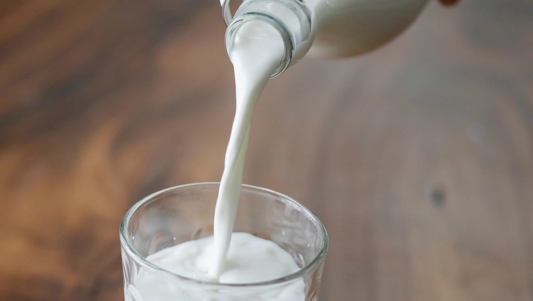 Glass of milk being poured