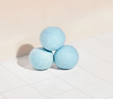 Dryer Ball Starter Set: 3 blue wool dryer balls on tile