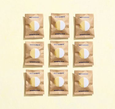 9 Blueland Multi-Surface refill tablets in compostable wrappers against yellow background