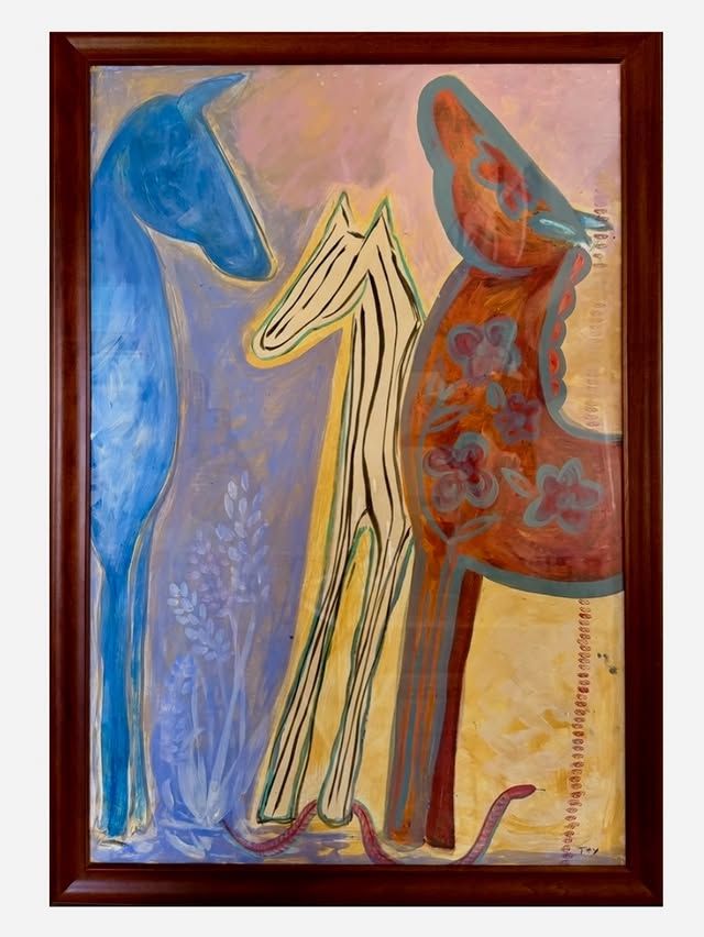 Three Graces — three horses in blue, cream, and red-orange against a warm pink and gold background, in a wooden frame