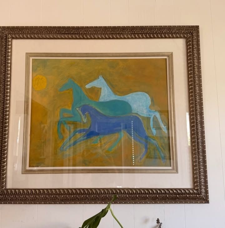 Race to the Sun — three horses in blues and teal galloping across a golden field beneath a yellow sun, in an ornate frame