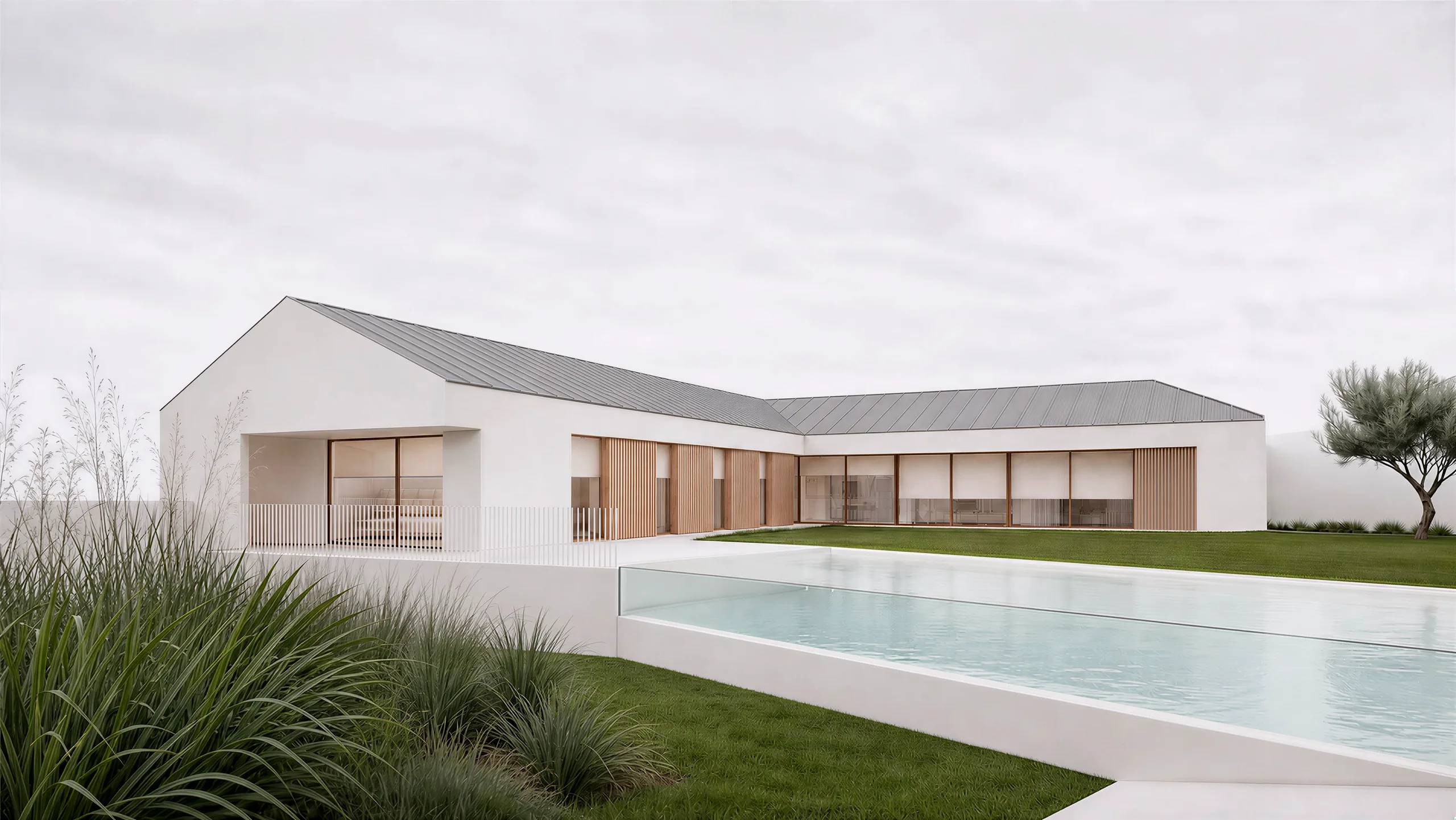 La casa en L en torno a la piscina, con cubiertas a dos aguas