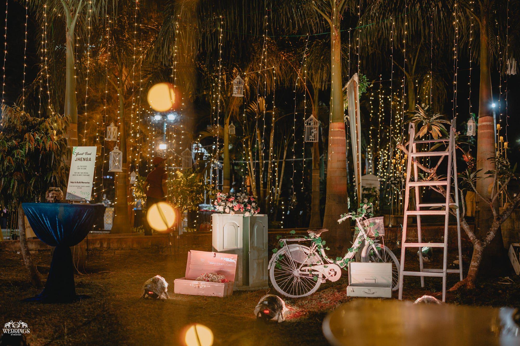 Garden reception at night beneath fairy-lit trees