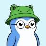 A cartoon penguin wearing a green frog bucket hat and round glasses.