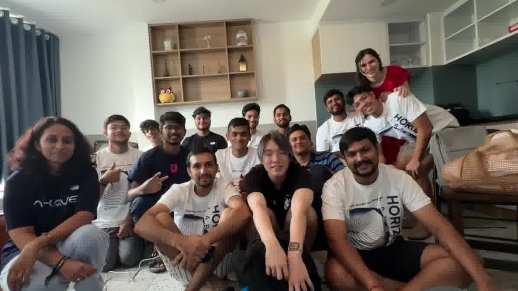 a group of people are posing for a picture in a living room .