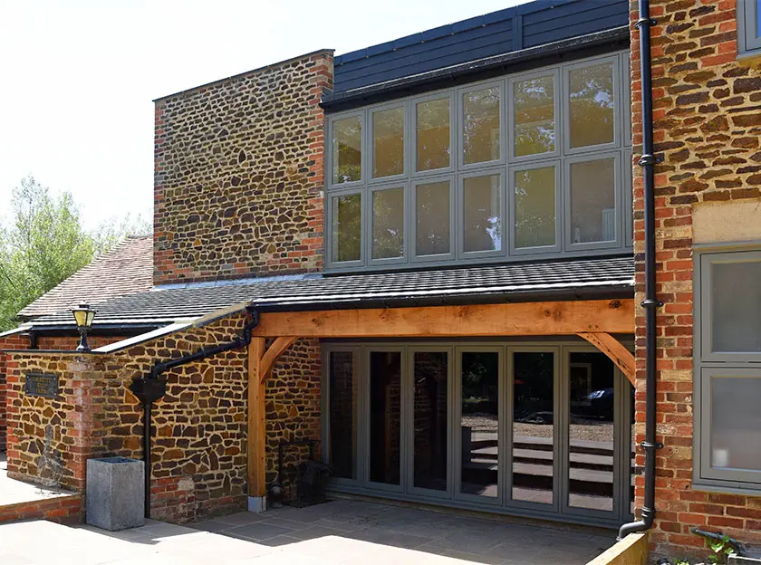 70s Home Reborn with Elegant Wooden Windows & Doors