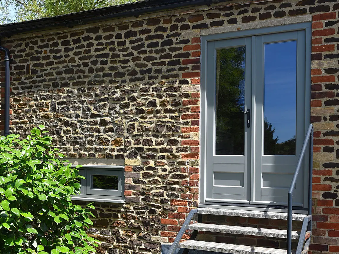 70s Home Reborn with Elegant Wooden Windows & Doors