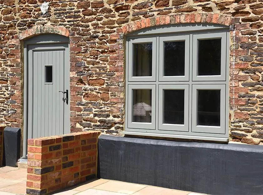 70s Home Reborn with Elegant Wooden Windows & Doors