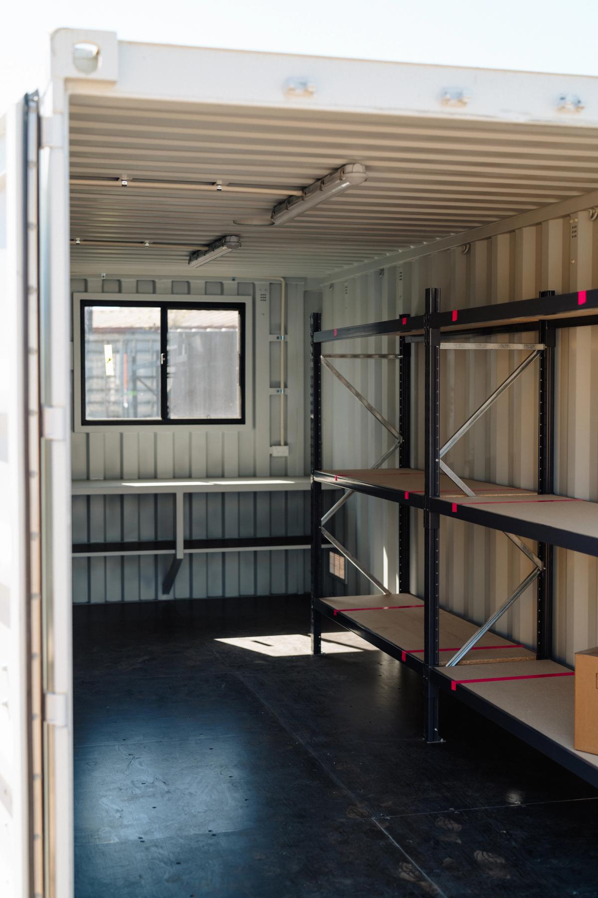 Inside The Eucalypt 20ft workshop, workbench and shelving