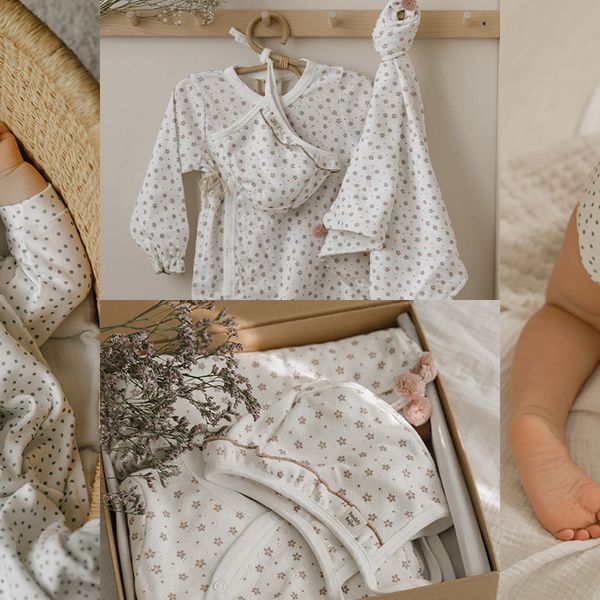 To the left, sleeping baby with white pyjamas and green small dots thogether with a matching hat. In the middle, white pyjamas with small pink flowers on together with a matching hat and blanket. To the right, baby cravling in the bed with the same pyjamas as in picture one. 