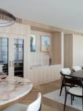 Pale timber joinery running the length of the living room