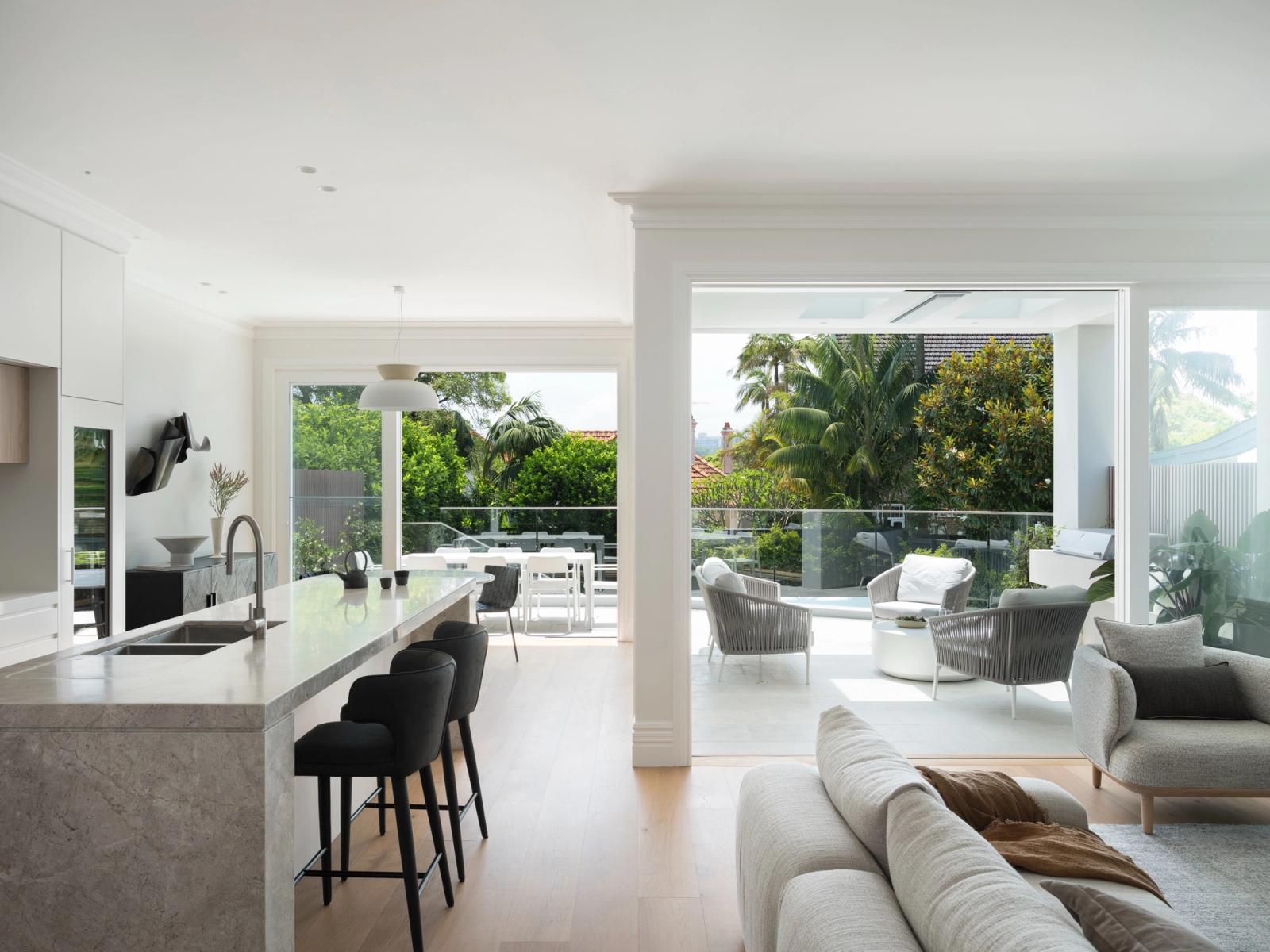 The new open-plan kitchen and living opening to the terrace