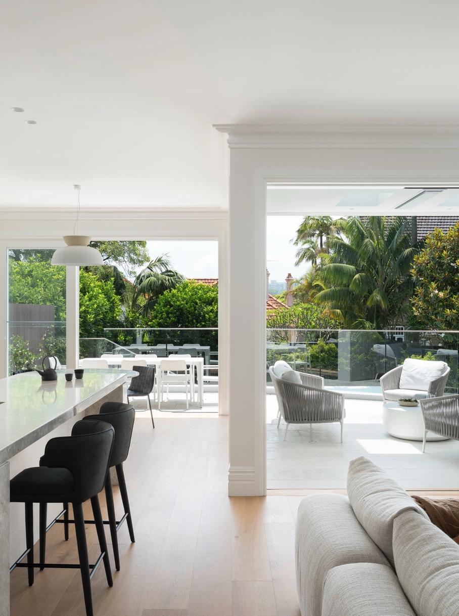 The new open-plan kitchen and living opening to the terrace