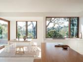 The open-plan kitchen and dining opening to the terrace