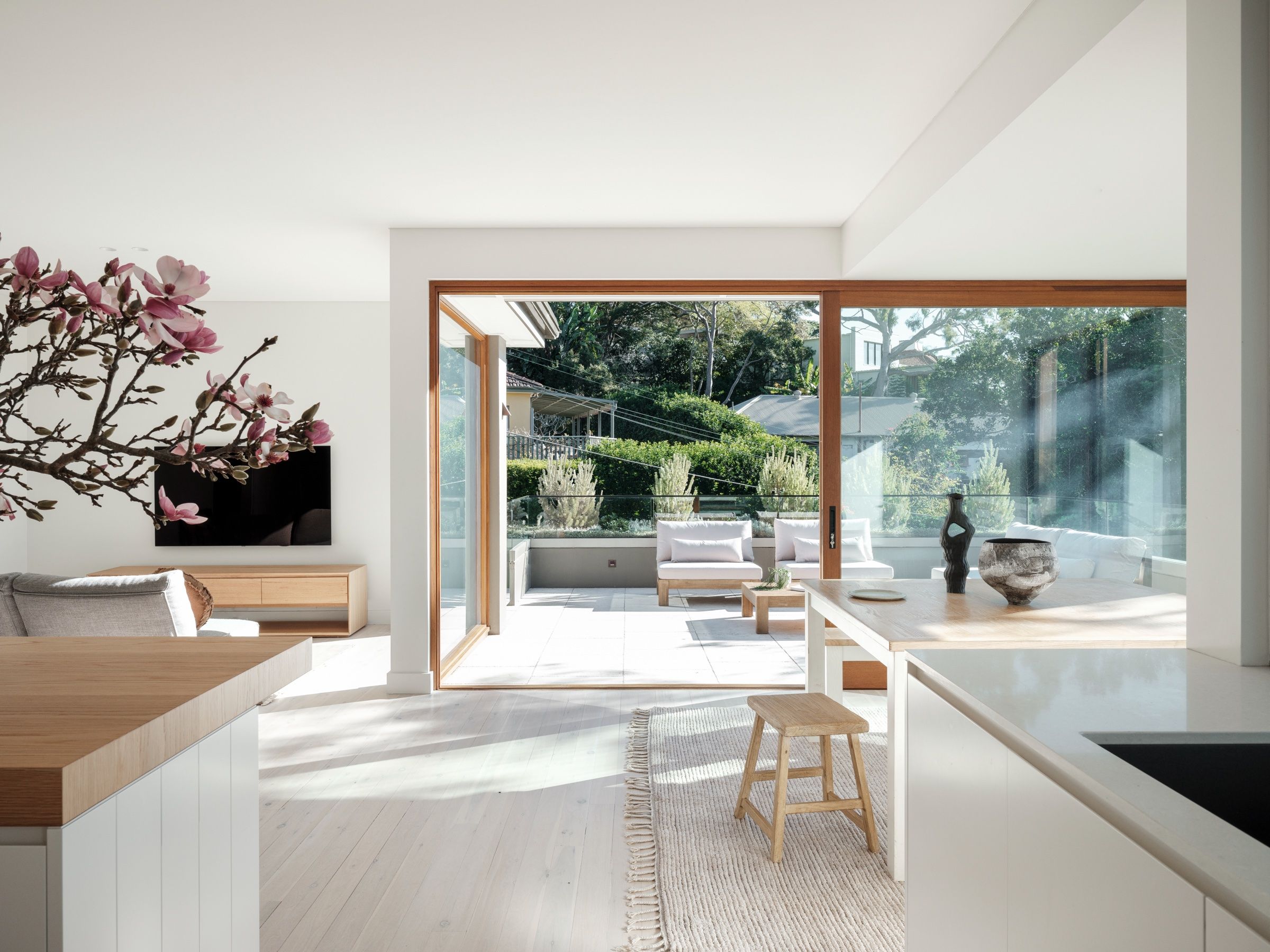 Living and dining flowing to the sun-drenched alfresco terrace