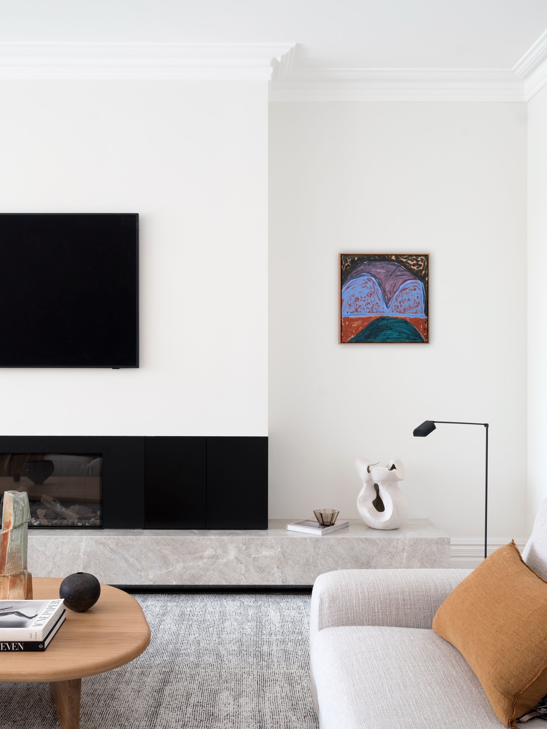 The informal living room with its black stone hearth